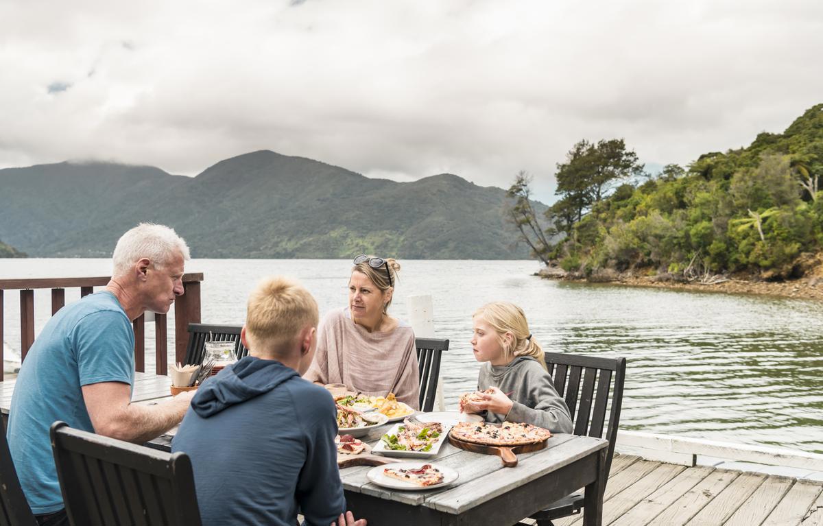 Punga_Cove_family_Boatshed_Cafe_and_Bar_eating_lunch_2019_MH