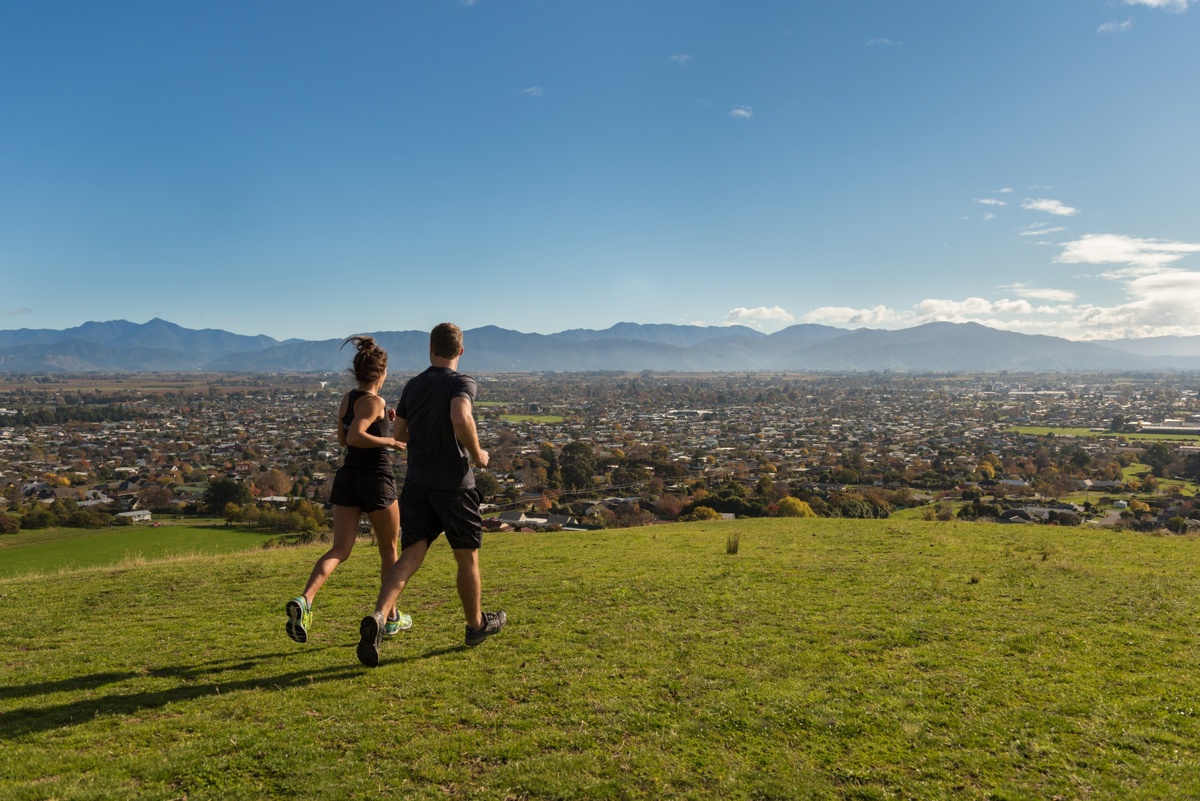 Two people jogging in the Wither Hills, Blenheim