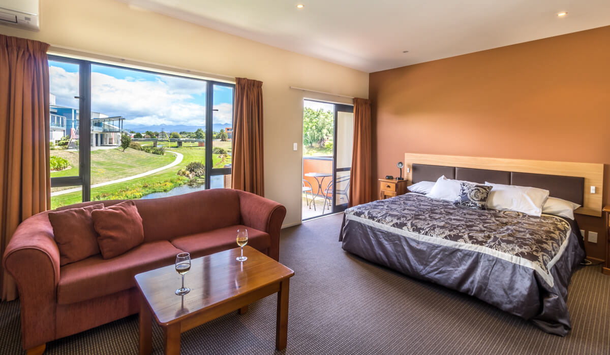 Lounge Bed And Balcony In Spa Studio At Waterfront Motels In Blenheim NZ