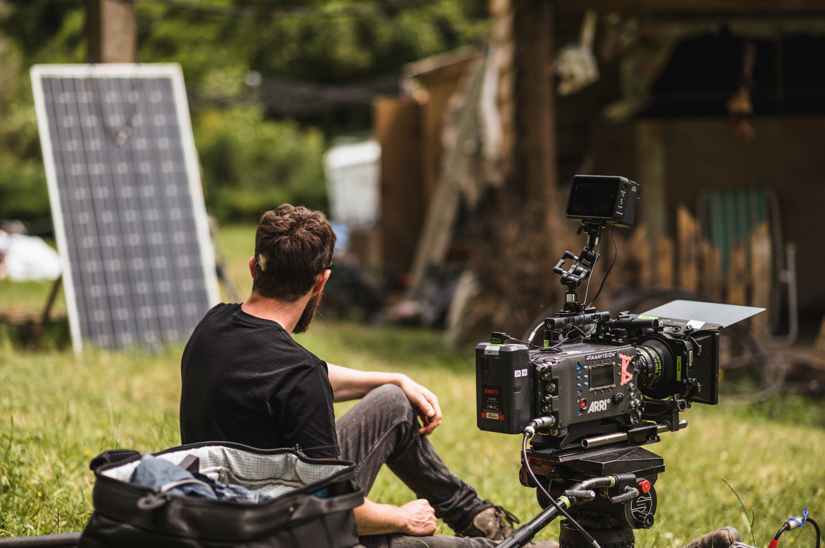 A cameraman takes a break on the set of Northspur